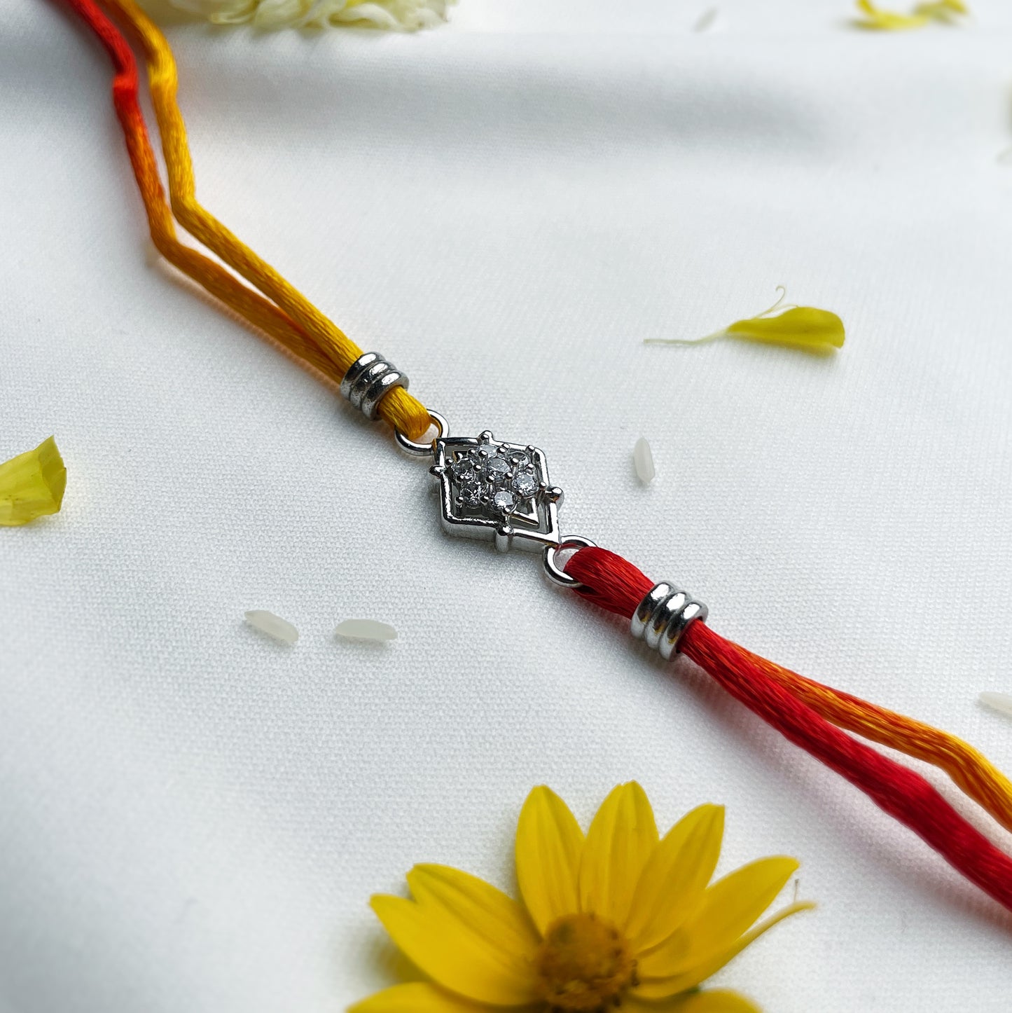 Silver Conical shape Zircon Rakhi