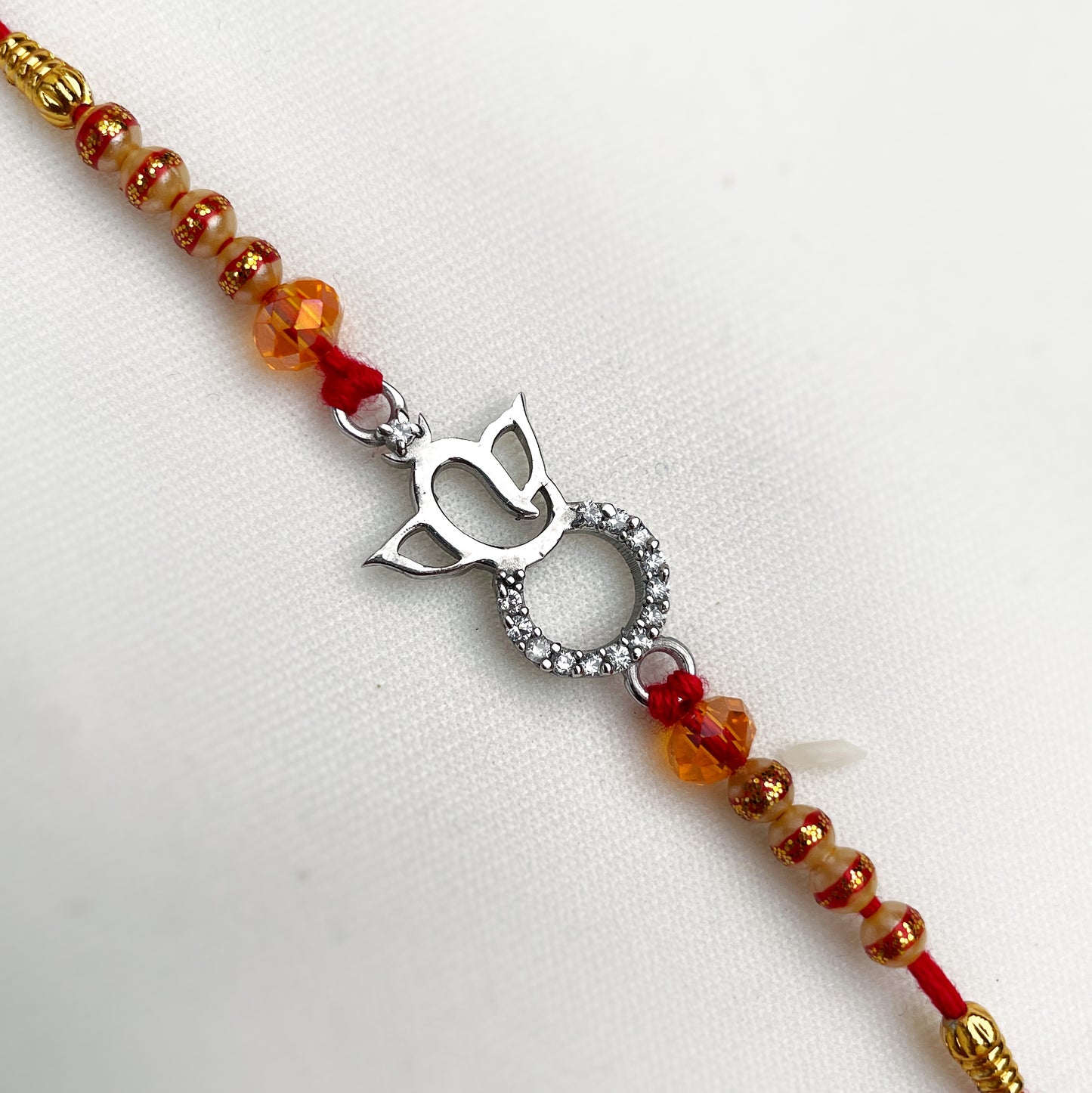 Silver Lord Ganesha Shape Zircon Rakhi