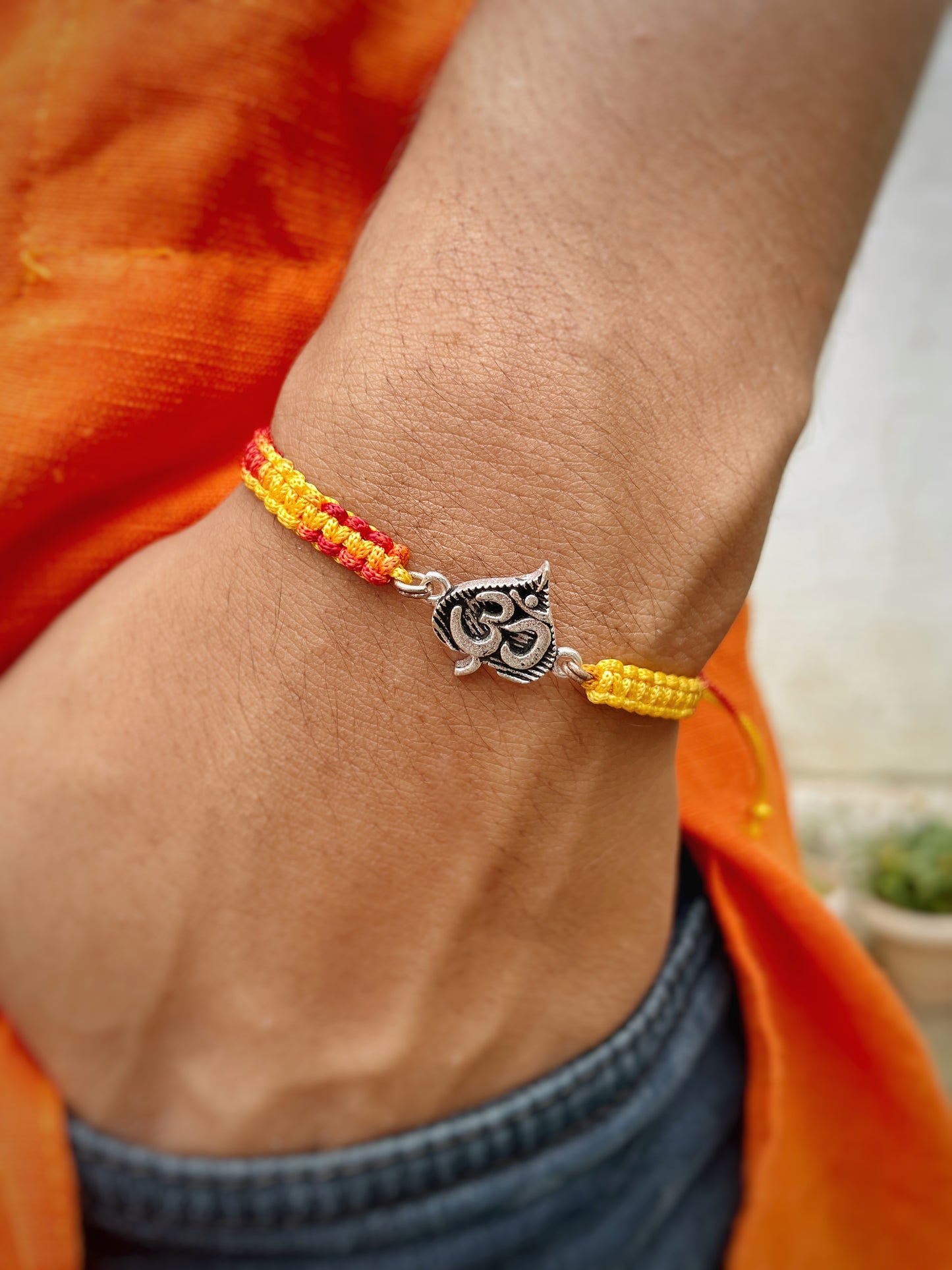 Oxidized Om in Leaf Rakhi